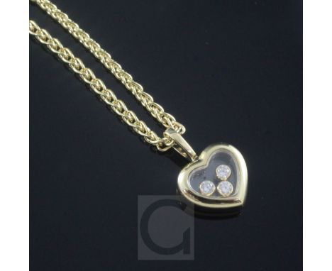A modern 18ct gold Chopard heart shaped pendant with three "floating" diamonds, on an 18ct gold Chopard chain, with original 