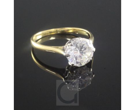 An 18ct gold and solitaire diamond ring, the round brilliant cut stone weighing approximately in excess of 2.50cts size R.