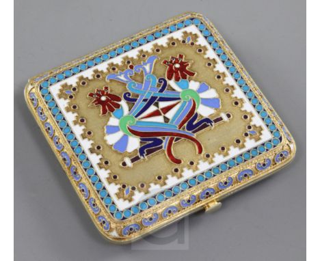 A late 19th century Russian 84 zolotnik silver gilt and cloisonne polychrome enamel cigarette case, decorated with twin styli