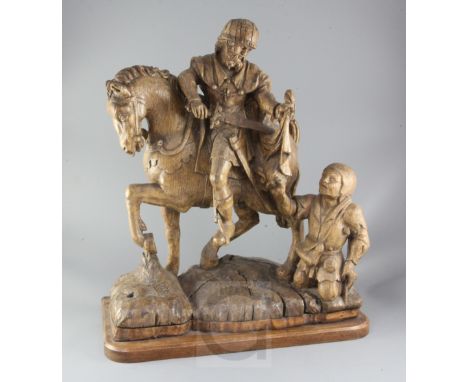 A 16th century South Netherlands oak carving of St Martin and the beggar, St Martin depicted dividing his cloak for the begga