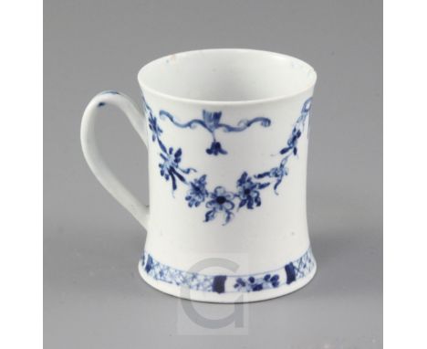 A very rare Worcester blue and white Floral Swag, Ribbon and Scroll pattern coffee can, c.1755, painted with wispy floral swa