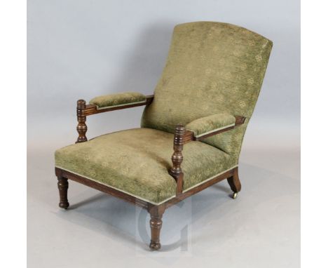 An Aesthetic movement oak armchair, in the manner of E.W. Godwin, with ring turned and fluted frame, ex Fine Art Society, W.2