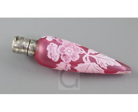 A Thomas Webb & Sons cameo glass scent bottle, late 19th century, of torpedo form cased in white over ruby and cut with flowe