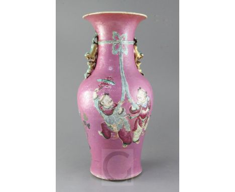 A large Chinese pink ground vase, late 19th century, painted with the He He Erxian holding a ribbon-tied bow and two phoenixe