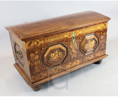 An early 19th century Hamburg oak and marquetry marriage coffer, inscribed J. Sophia Martens Anno 1823, and decorated with bi