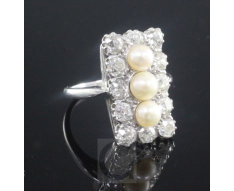 An Art Deco white gold, diamond and cultured pearl rectangular tablet ring, with three central pearls bordered with twelve ro