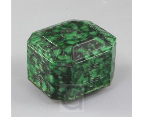 A Chinese carved Maw Sit Sit jade box and cover, 20th century, of elongated octagonal form, carved in low relief with shou ar