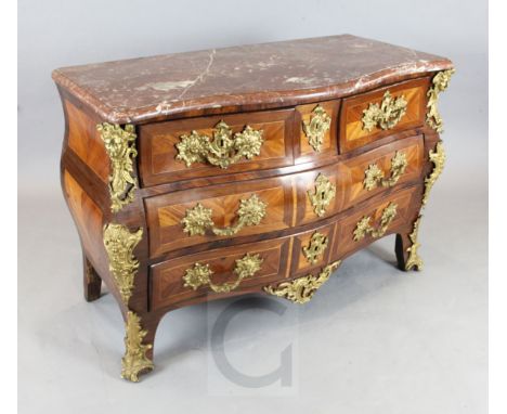 A Louis XV ormolu mounted kingwood bombe commode, with serpentine rouge marble top, two short and two long drawers, W.4ft 2in