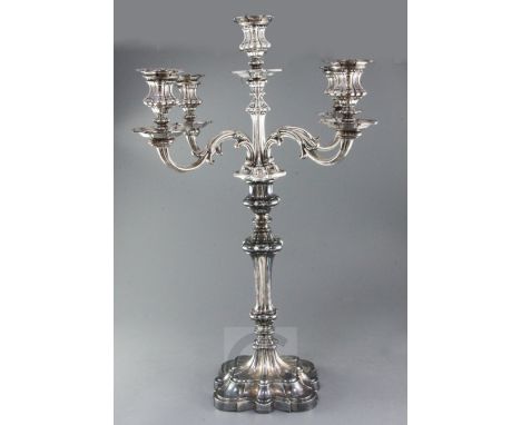 A late Victorian Elkington & Co large silver plated four branch, five light candelabrum, with scroll arms and knopped taperin