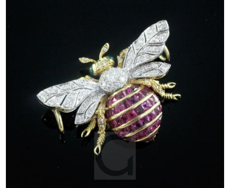 An 18ct gold, ruby, emerald and diamond set bee pendant, diameter 38mm, gross 11.7 grams.