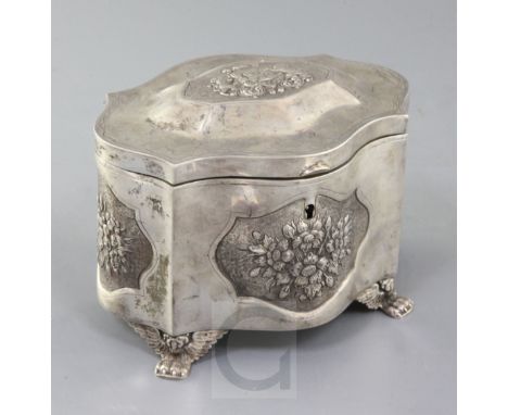 JUDAICA: A mid 19th century Polish 84 zolotnik silver etrog box, of serpentine form, with embossed floral panels and lid deco