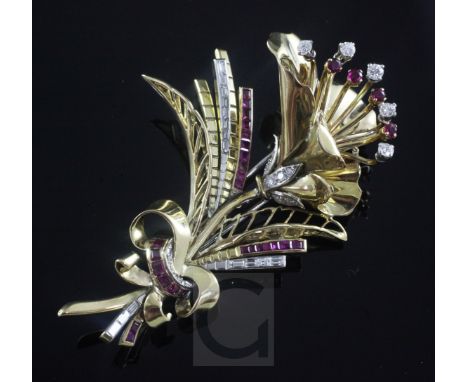 A gold, ruby and diamond set floral spray brooch, set with round and baguette cut stones, apparently unmarked, 76mm, gross 37