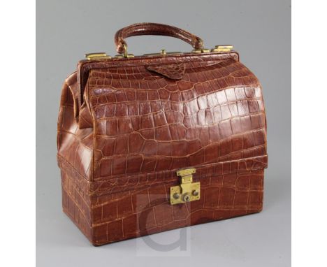 A 1930's Hermes of Paris crocodile handbag, with pale brown leather interior stamped Hermes Paris, 24FG St Honore, and velvet