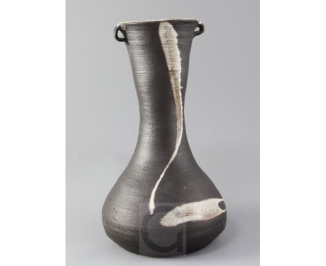 A large St Ives pottery baluster vase, by Janet Leach, with a pair of lug-shaped handles to the neck and white slip decoratio