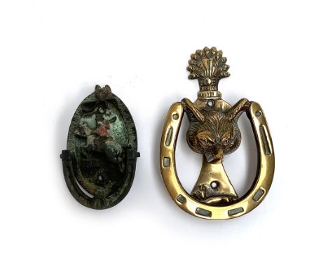 A brass fox mask and horseshoe door knocker, 14.5cm; together with another hunting knocker with huntsman in relief (2) 