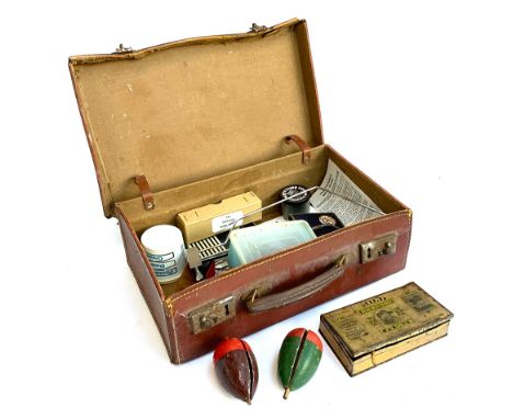 A brown leather overnight case containing a quantity of vintage fly tying equipment, in particular a Veniard vice 