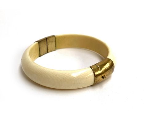 A 19th century ivory and brass bangle, 7.5cmD 