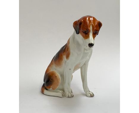 A Royal Worcester figure of a seated foxhound, 17cm high 