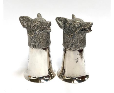 A pair of plated fox mask stirrup cups, silver gilt interior, each 12.5cm high 