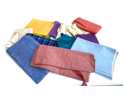 A number of bolts of vintage fabric 