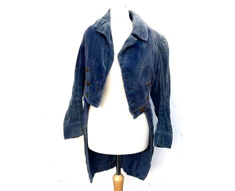 A Regency style blue velvet child's tail coat; together with a silk jacket with lace trims and whalebone corset; a small sati