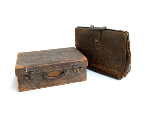 A vintage leather suitcase, 51cmW, with silk lined interior; together with a large leather briefcase, 51cmW 