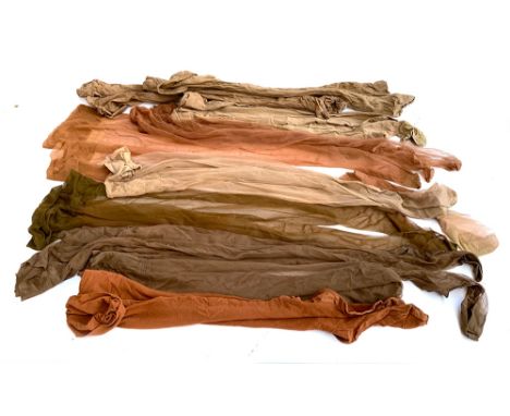 Nine pairs of vintage silk stockings, various shades 