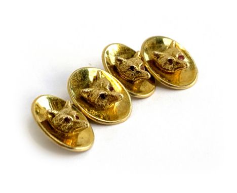 A pair of 9ct gold fox mask cufflinks, by Cropp &amp; Farr, London 1973, each with two fox masks with ruby set eyes, with cha