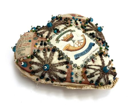 A WW1 beadwork heart shaped pin cushion/sweetheart cushion with regimental crest for Prince Albert's Somerset Light Infantry 