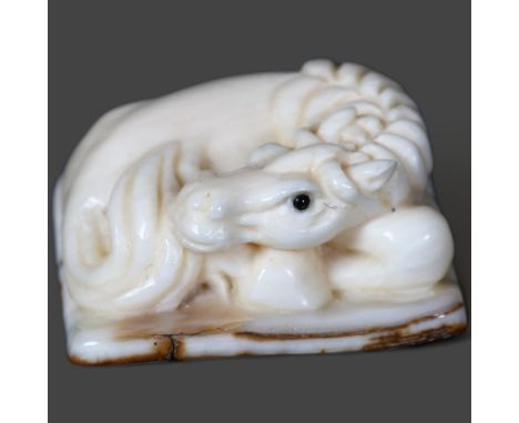 Carving / Curiosity - A carved fossilised Mammoth tusk Netsuke of a horse 