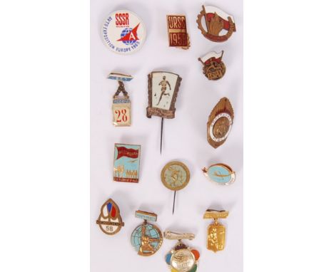 A collection of 14x enamel & metal sporting & various events 20th century USSR Soviet Union & communist states badges to incl