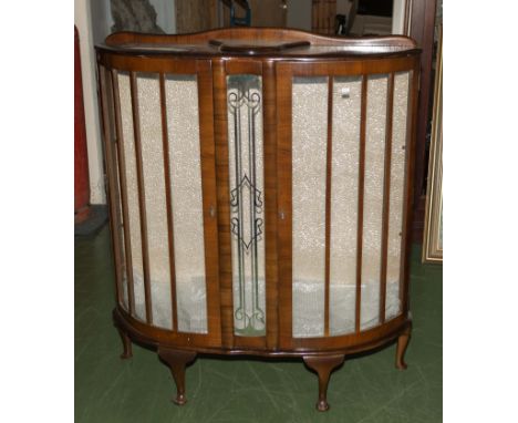 A vintage walnut display cabinet.