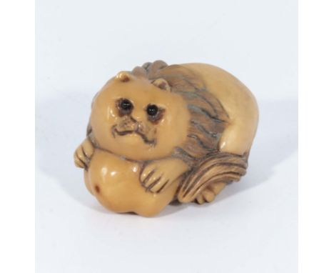 A netsuke of lion guarding the sacred pumpkin  