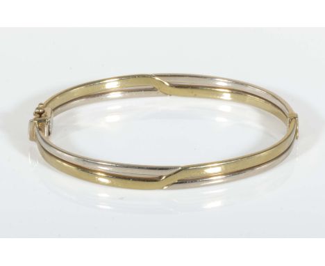An 9ct yellow gold bangle