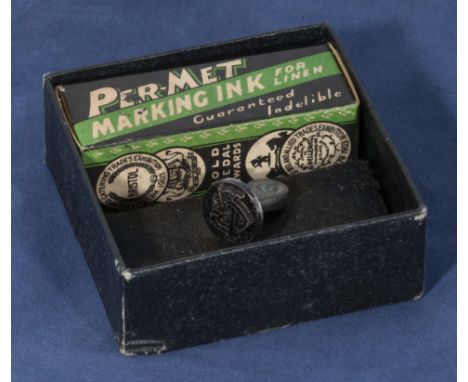 A vintage per-met indelible inking stamp and pad 