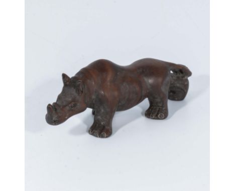 Hand carved hardwood netsuke of a rhino