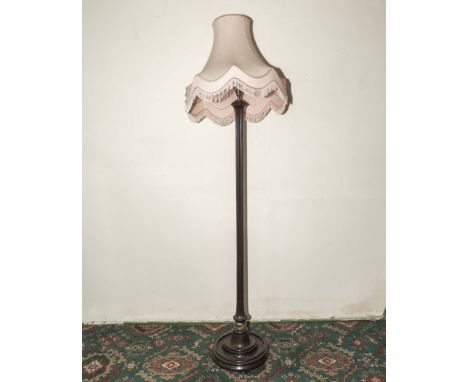 A mahogany standard lamp