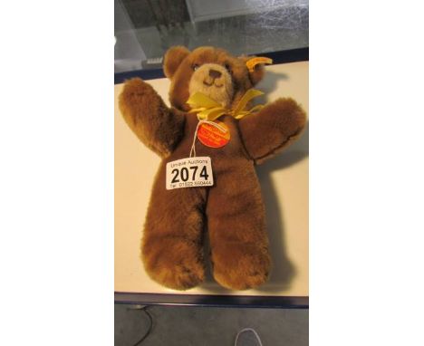 A small Steiff teddy bear.