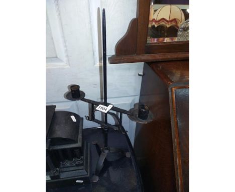 A Blacksmith made? Iron candlestick. 30cm x height 55cm.