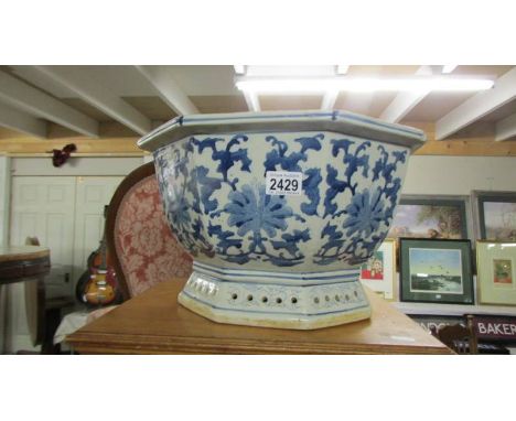 A large Chinese blue and white planter, 39.5 x 23.5 cm, 42 cm at widest point, COLLECT ONLY.*Condition report*Chip to the top