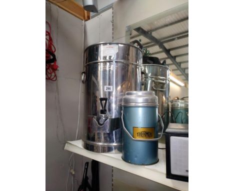 A hot water urn and a vintage thermos food flask.