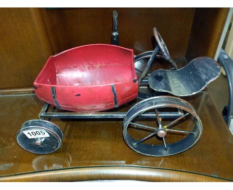 A novelty pressed steel tractor garden planter