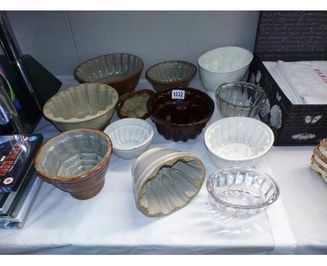 A collection of 12 glass &amp; ceramic jelly moulds