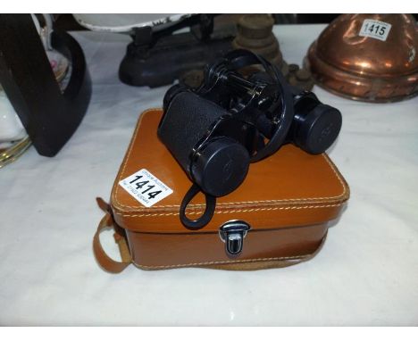 A Vintage scope model 3850 8x30 binoculars in case.