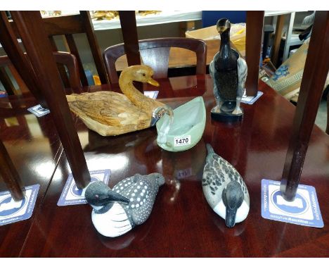 A vintage plastic duck clothes brush glass planter and two plastic and one wooden duck ornaments.