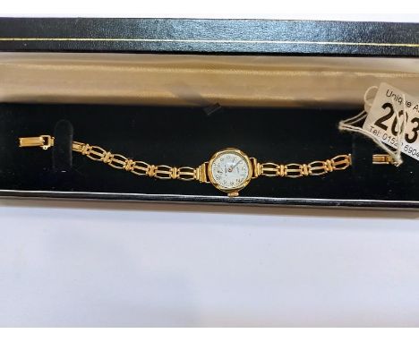 A vintage gold watch in working order with gold strap, 14.5gms 