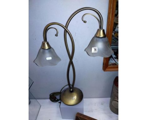 An art nouveau style brass table lamp