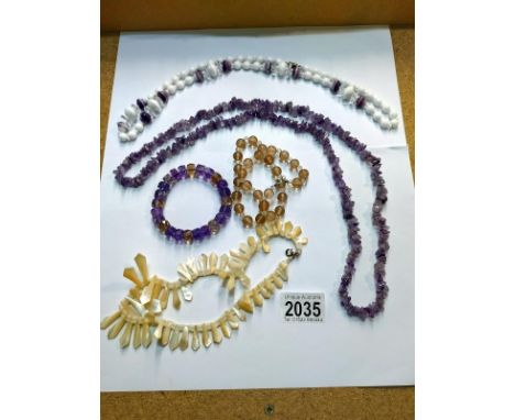An amethyst stone necklace, amethyst bracelet with mother of pearl necklace &amp; other vintage necklaces 