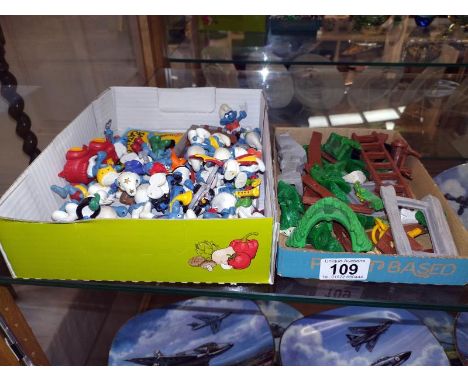 A good selection of vintage Smurfs with extra and catalogue 