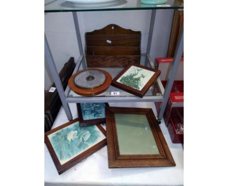 An oak letter rack, selection of oak frames and a barometer 